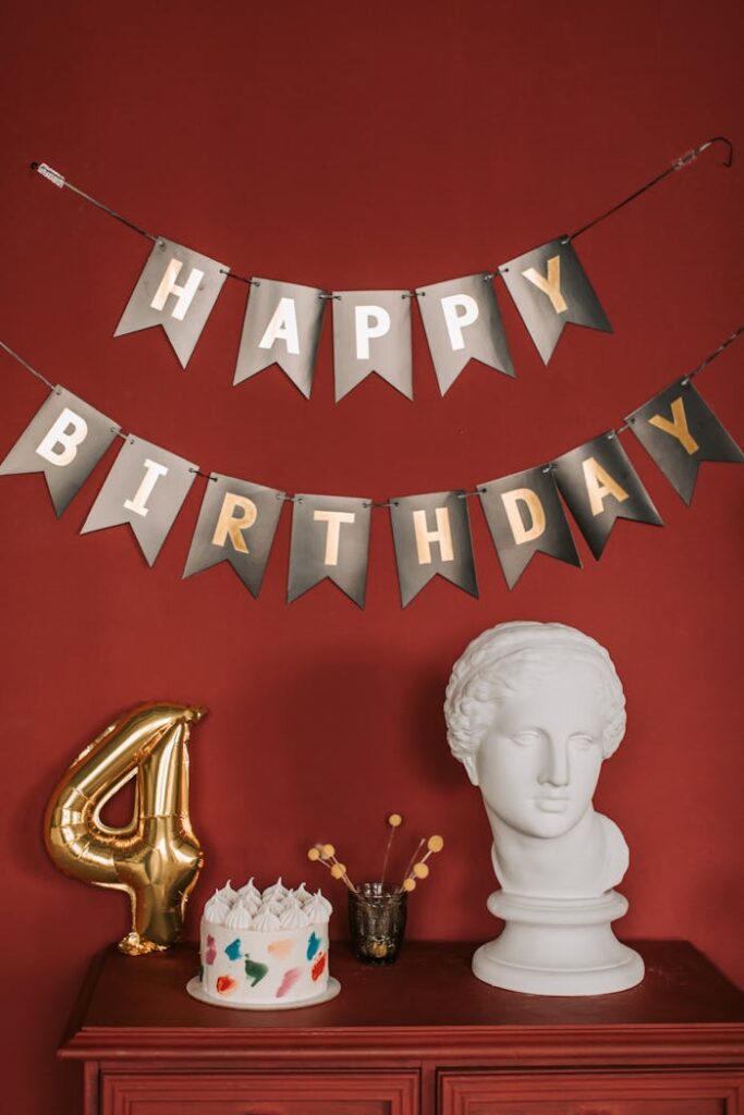 A Birthday Cake and  a Head Bust